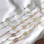 Lot de 12 (1,95€ Pièce) : Bracelet doré et argenté Motifs Lettres/Coeurs/Etoiles - Acier Inoxydable