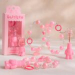 Présentoir de 12 (2,70€ Pièce) : Gloss pour lèvres OURSON attaché au bracelet – Kevin & Coco