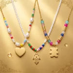💎 Mélange de 10 Colliers Perles & Dorés en Acier Inoxydable – Motifs Assortis