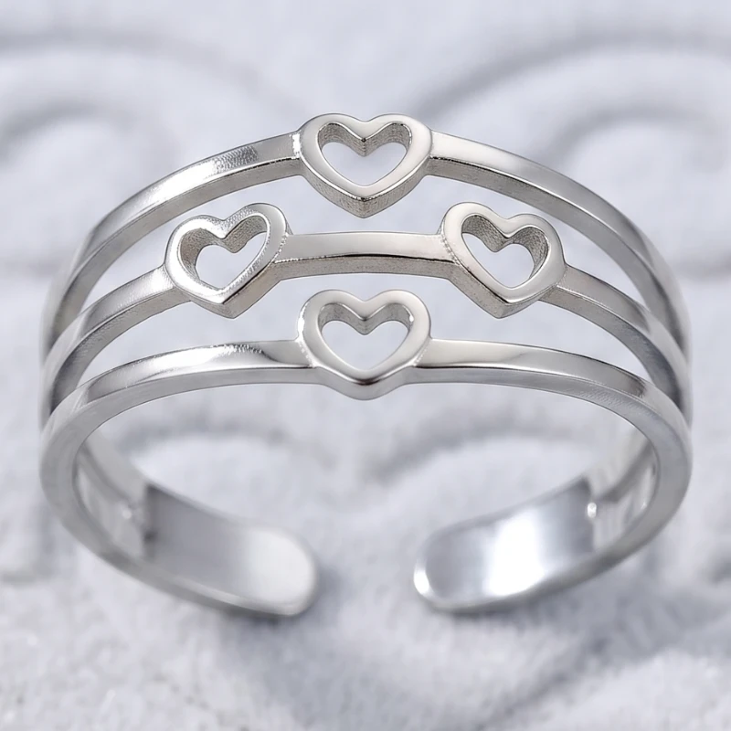 grossiste en bague acier inoxydable doré et argent (5) 🌟 Pack Revente Premium : Collection 12 Bagues Argentées "Coeur" Acier Inoxydable & Présentoir Coussin – Image 1